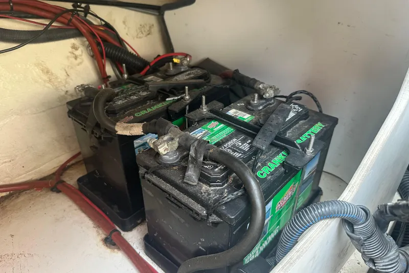 Slide: The Image of Batteries in a 2007 Sea Ray 230 Select boat, connected with cables. - 20