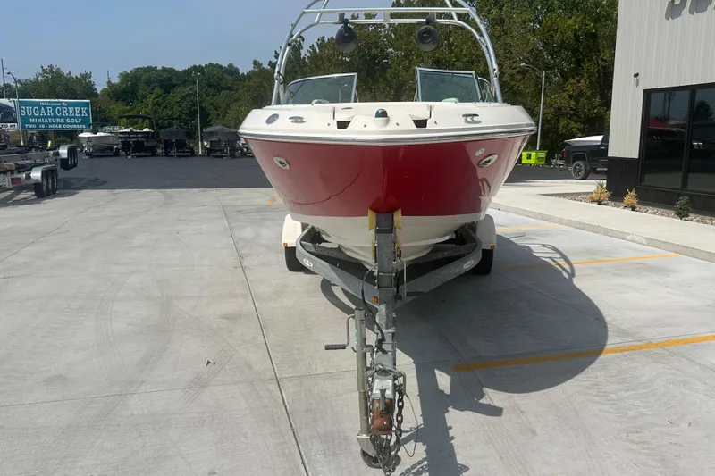Slide: The Image of 2007 Sea Ray 230 Select boat on trailer in parking lot. - 5