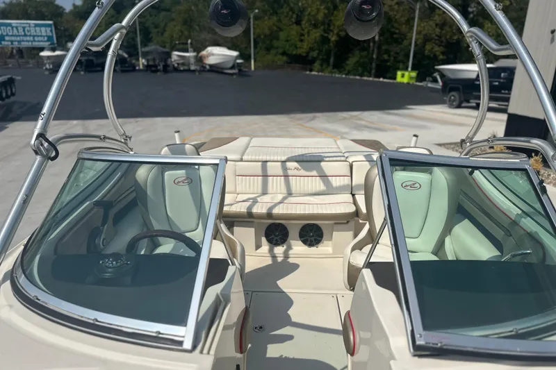 Slide: The Image of 2007 Sea Ray 230 Select boat interior with seating and steering wheel. - 7