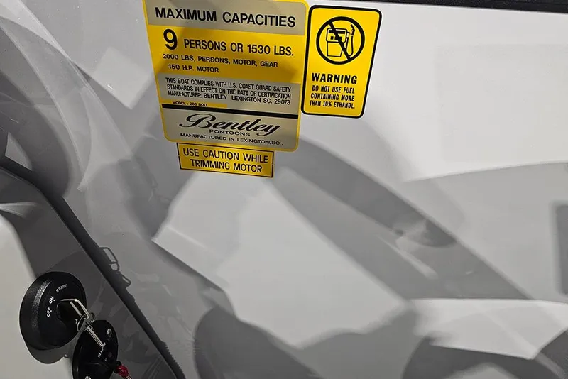 Slide: The Image of 2026 Bentley Pontoons Bolt capacity and safety warning labels on boat interior. - 10