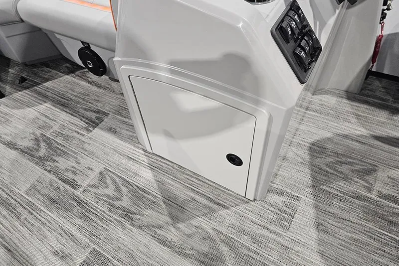 Slide: The Image of 2026 Bentley Pontoons Bolt interior console with storage compartment and control panel. - 11