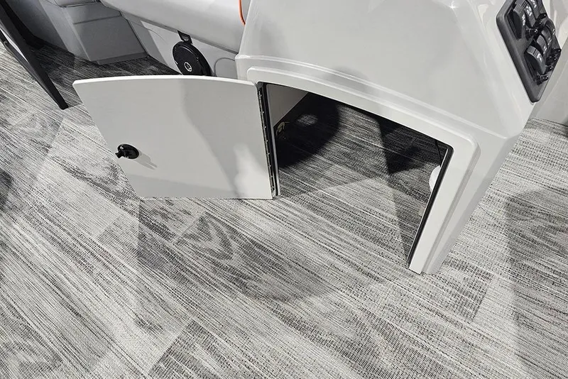 Slide: The Image of 2026 Bentley Pontoons Bolt interior with open storage compartment and modern flooring. - 12