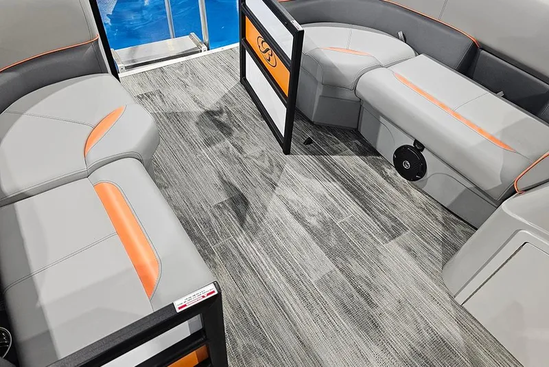 Slide: The Image of 2026 Bentley Pontoons Bolt interior with gray and orange seating, modern flooring. - 16