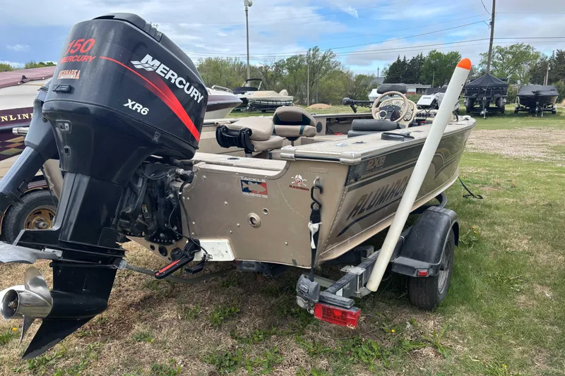 Slide: The Image of 2001 Alumacraft Tournament Pro 185 CS boat with Mercury XR6 engine on trailer. - 6