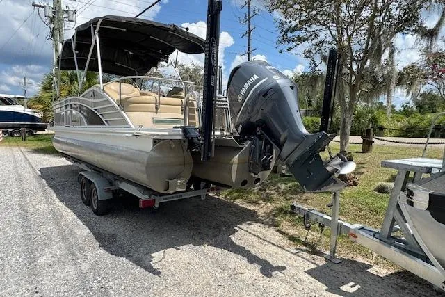 Slide: The Image of 2016 Bennington 2575 RCW pontoon boat on trailer with Yamaha outboard motor. - 4