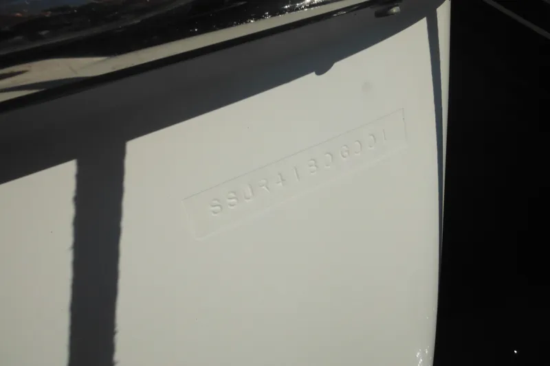 Slide: The Image of 2001 Tiara Yachts 3500 Open hull identification number embossed on white surface. - 10