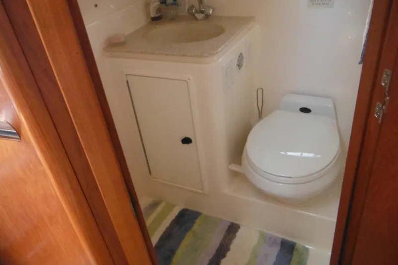 Slide: The Image of Bathroom interior of 2001 Tiara Yachts 3500 Open, featuring toilet and sink. - 109