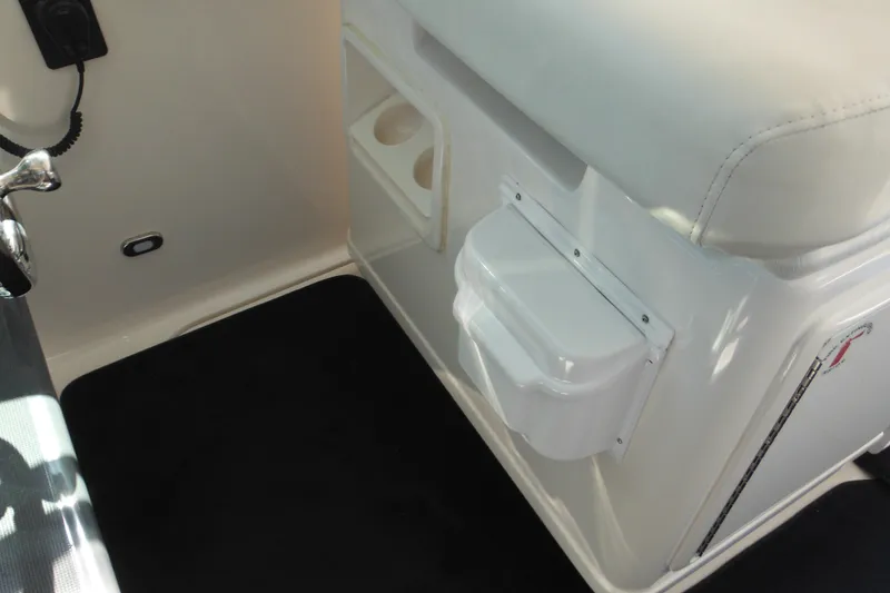 Slide: The Image of Interior view of 2001 Tiara Yachts 3500 Open, featuring seating and storage compartments. - 114