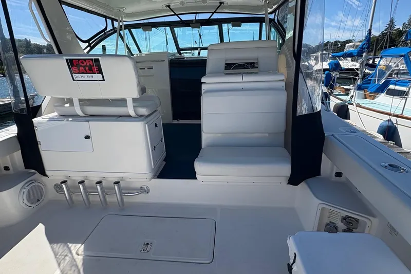 Slide: The Image of 2001 Tiara Yachts 3500 Open for sale, white interior, docked at marina. - 120