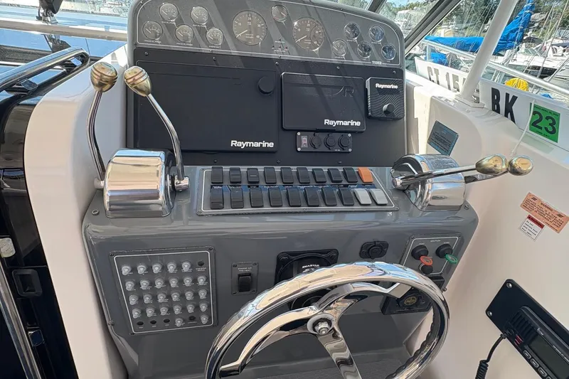 Slide: The Image of Control panel of a 2001 Tiara Yachts 3500 Open with Raymarine equipment. - 124