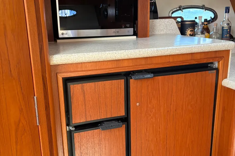 Slide: The Image of 2001 Tiara Yachts 3500 Open interior with wood cabinetry and countertop. - 131