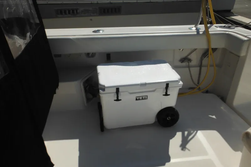 Slide: The Image of 2001 Tiara Yachts 3500 Open deck with Yeti cooler and storage area. - 14