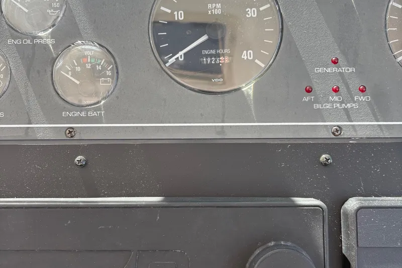 Slide: The Image of Dashboard of a 2001 Tiara Yachts 3500 Open, showing engine gauges and indicators. - 140