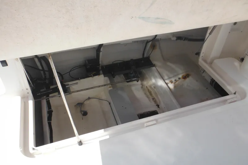 Slide: The Image of 2001 Tiara Yachts 3500 Open engine compartment, showing interior components and wiring. - 22