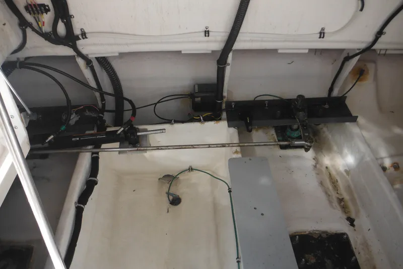 Slide: The Image of Engine compartment of a 2001 Tiara Yachts 3500 Open, showing mechanical components and wiring. - 23