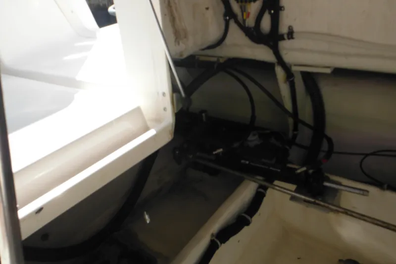 Slide: The Image of Engine compartment of 2001 Tiara Yachts 3500 Open, showing mechanical components and wiring. - 25