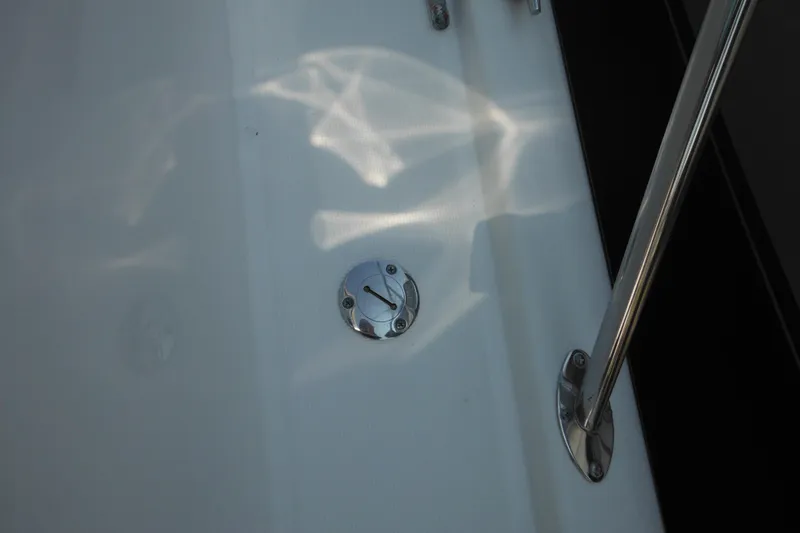 Slide: The Image of 2001 Tiara Yachts 3500 Open deck detail with metal fixtures and reflections. - 30