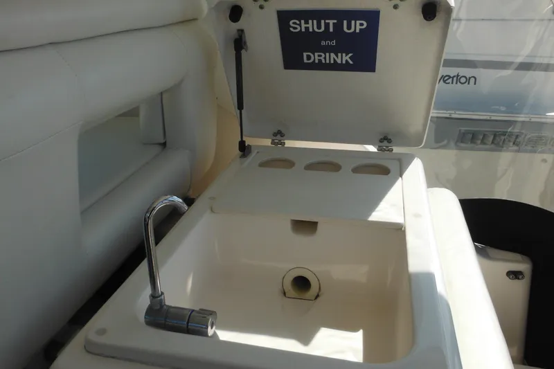 Slide: The Image of 2001 Tiara Yachts 3500 Open sink area with humorous "Shut Up and Drink" sign. - 40