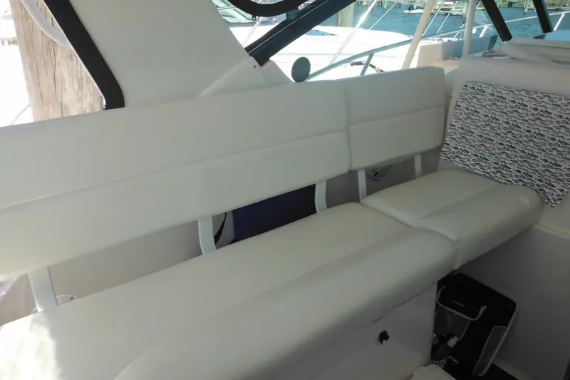 Slide: The Image of 2001 Tiara Yachts 3500 Open interior with white seating and patterned cushion. - 50