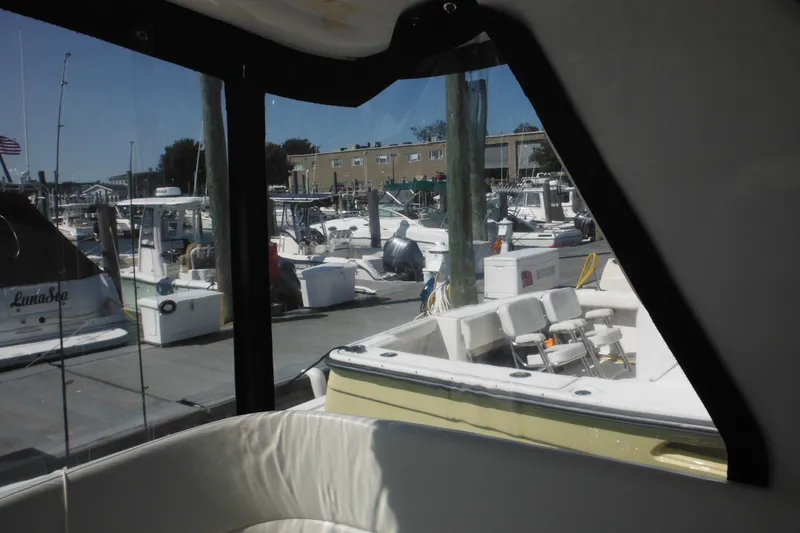Slide: The Image of 2001 Tiara Yachts 3500 Open at marina, view from cabin window. - 56