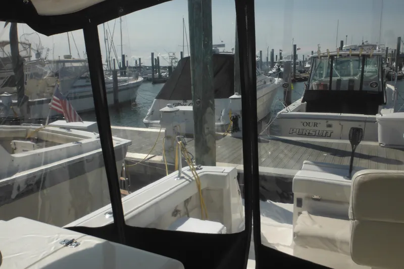 Slide: The Image of 2001 Tiara Yachts 3500 Open docked at marina, view from cockpit. - 58