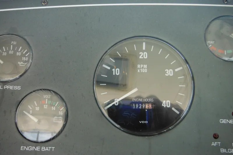 Slide: The Image of Dashboard gauges of a 2001 Tiara Yachts 3500 Open, showing RPM and engine hours. - 66