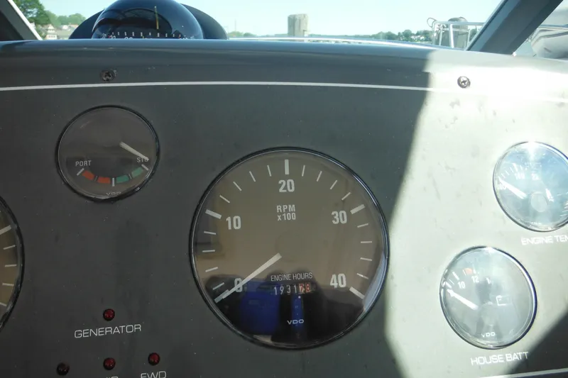 Slide: The Image of Dashboard of a 2001 Tiara Yachts 3500 Open showing RPM and engine gauges. - 67
