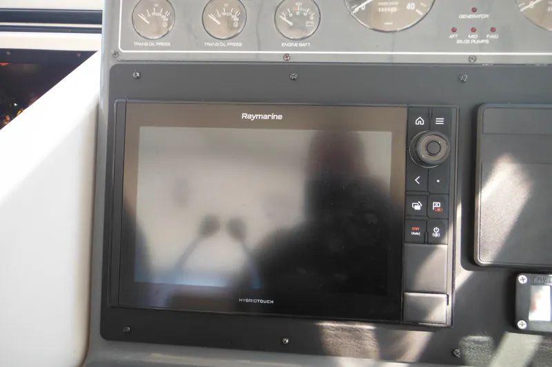Slide: The Image of Raymarine display on 2001 Tiara Yachts 3500 Open dashboard with gauges. - 69
