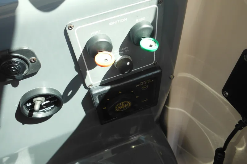 Slide: The Image of Control panel of a 2001 Tiara Yachts 3500 Open, featuring ignition and switches. - 74