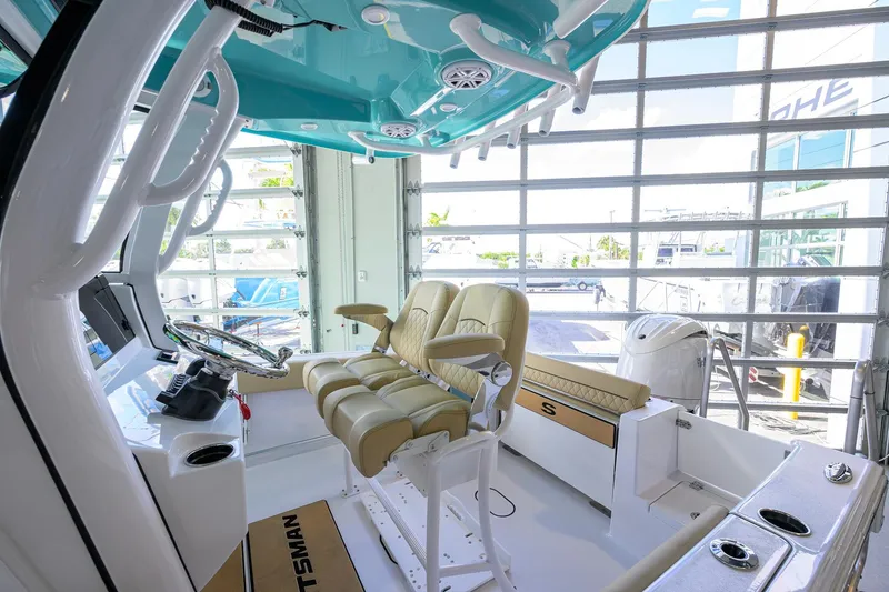 Slide: The Image of 2026 Sportsman Open 212 Center Console boat interior with modern seating and controls. - 12