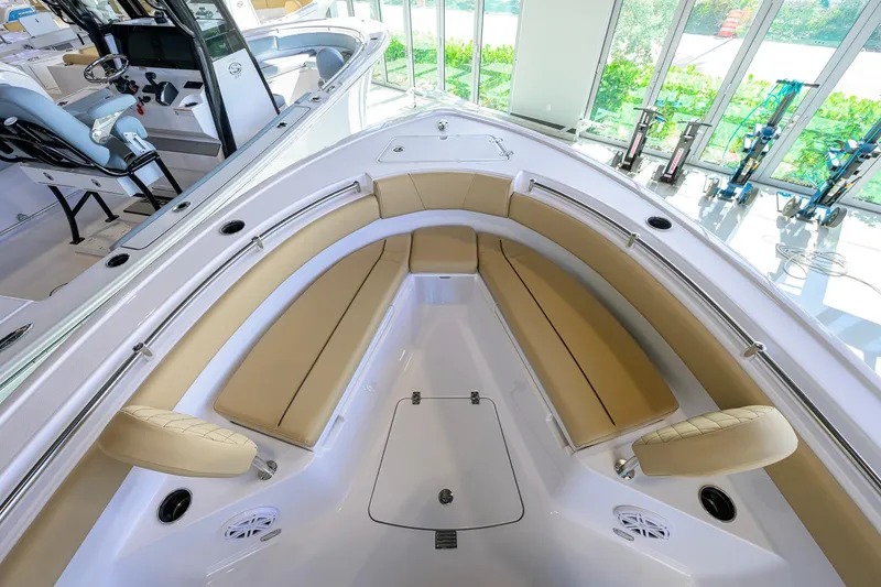 Slide: The Image of 2026 Sportsman Open 212 Center Console boat interior with beige seating and modern design. - 15