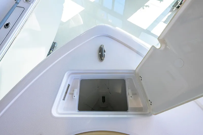 Slide: The Image of Open storage compartment on 2026 Sportsman Open 212 Center Console boat. - 16