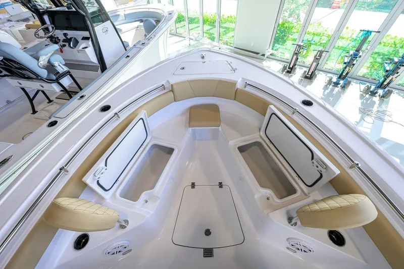 Slide: The Image of 2026 Sportsman Open 212 Center Console boat interior with seating and storage compartments. - 20