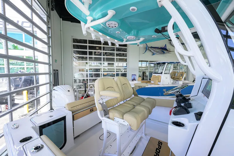 Slide: The Image of 2026 Sportsman Open 212 Center Console boat interior with modern seating and controls. - 22