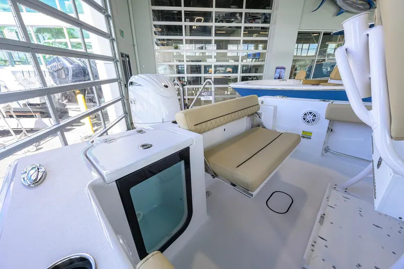 Slide: The Image of 2026 Sportsman Open 212 Center Console boat interior with seating and storage features. - 26