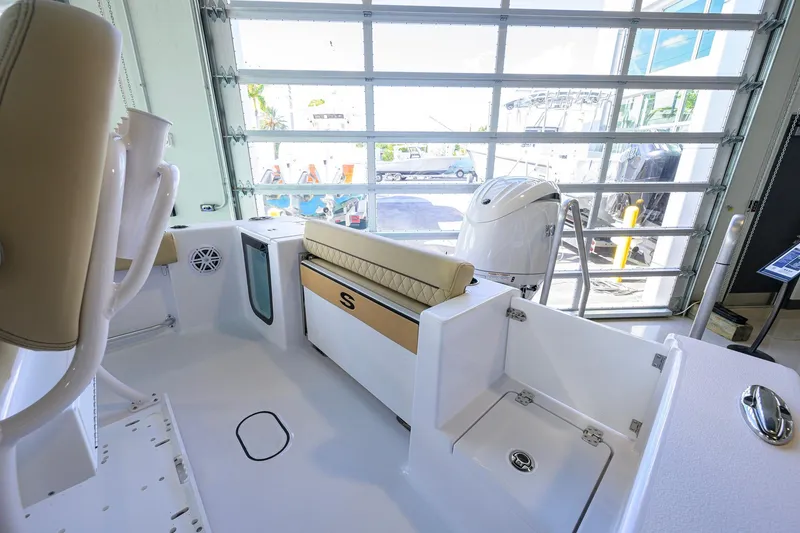 Slide: The Image of 2026 Sportsman Open 212 Center Console boat interior with seating and storage features. - 27