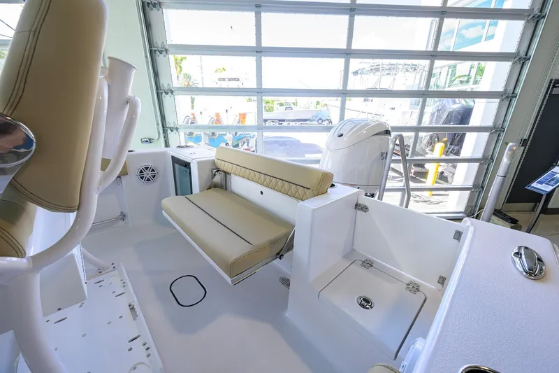 Slide: The Image of 2026 Sportsman Open 212 Center Console boat interior with beige seating and modern design. - 28