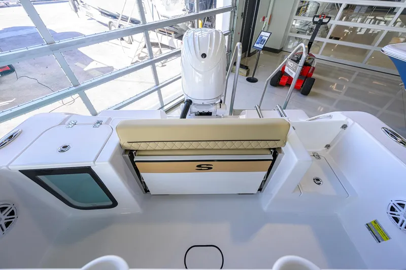 Slide: The Image of 2026 Sportsman Open 212 Center Console boat interior with seating and storage features. - 29