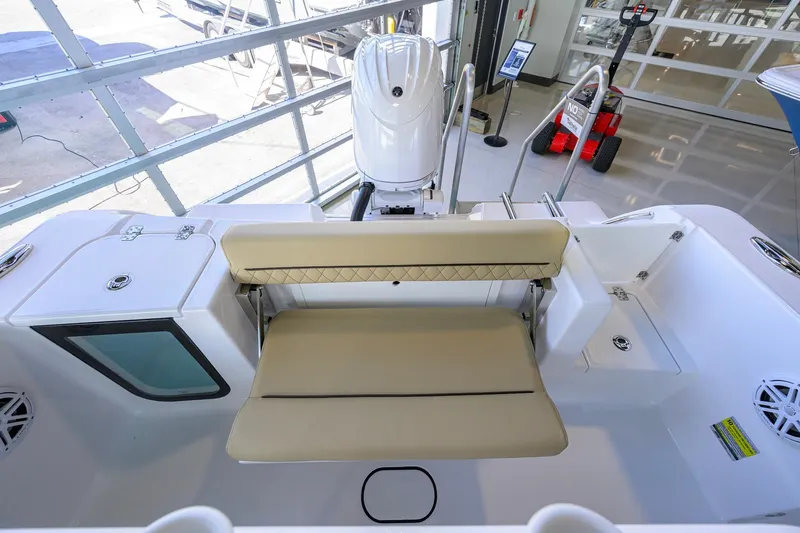 Slide: The Image of 2026 Sportsman Open 212 Center Console boat interior with beige seating and modern design. - 31