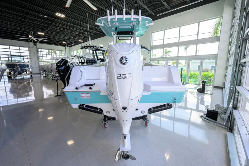 Slide: The Image of 2026 Sportsman Open 212 Center Console boat displayed in a showroom. - 35