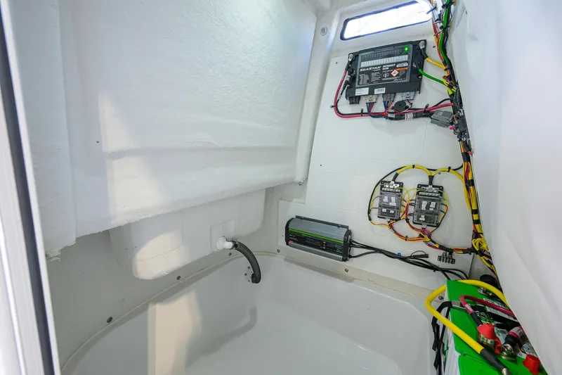 Slide: The Image of Interior view of 2026 Sportsman Open 212 Center Console boat's electrical wiring and components. - 40