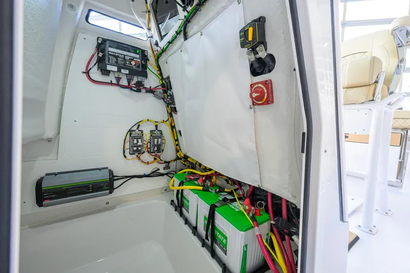 Slide: The Image of Electrical system inside 2026 Sportsman Open 212 Center Console boat, featuring batteries and wiring. - 41