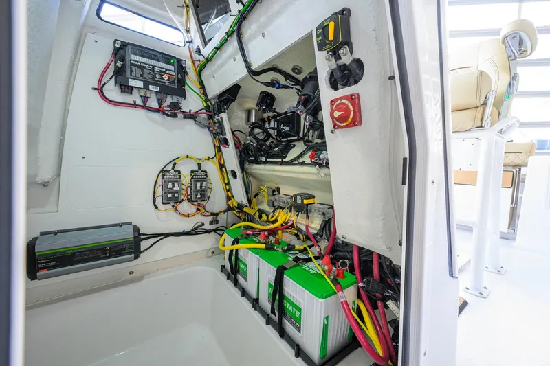 Slide: The Image of Interior view of 2026 Sportsman Open 212 Center Console boat's electrical system and battery setup. - 42