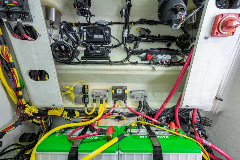 Slide: The Image of Electrical wiring and battery setup in a 2026 Sportsman Open 212 Center Console boat. - 43