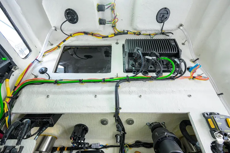 Slide: The Image of 2026 Sportsman Open 212 Center Console wiring and electronics setup, showcasing detailed internal components. - 45