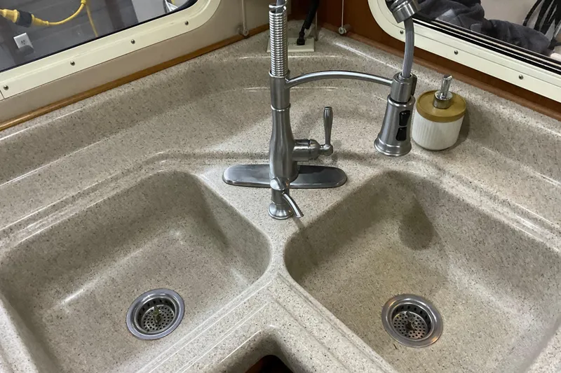 Slide: The Image of Dual kitchen sink with modern faucet in 2002 American Tug Hull #24 boat. - 14