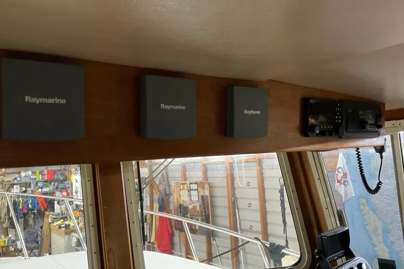 Slide: The Image of Interior of 2002 American Tug Hull #24 with Raymarine equipment and radio. - 22
