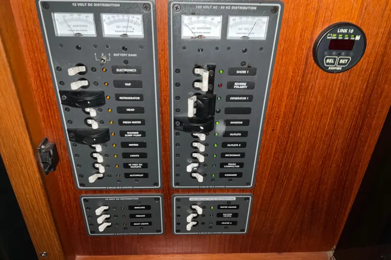 Slide: The Image of Electrical control panel on a 2002 American Tug Hull #24 boat. - 23