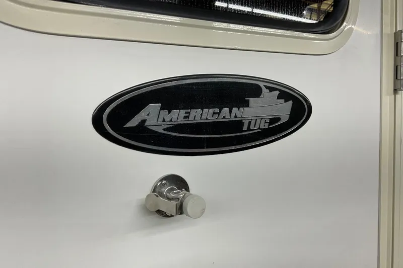 Slide: The Image of American Tug Hull #24, 2002 model, logo on white surface. - 28