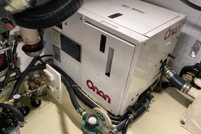 Slide: The Image of Engine room of 2002 American Tug Hull #24 with Onan generator. - 32